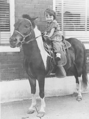 Sandra Thomson as a young child riding a pony. [195-]. PAA#PR2012.0422.0050.0001