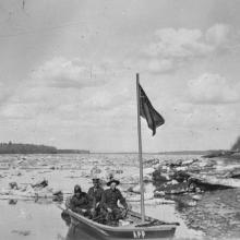 Alberta Provincial Police patrolling the Peace River in a boat, near Fort Vermilion. Date: May 1924. <BR />Photo A13834