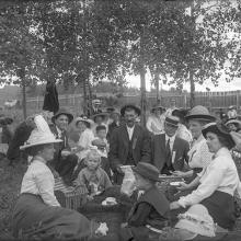 Family group having picnic in the yard, PAA Image # IR56